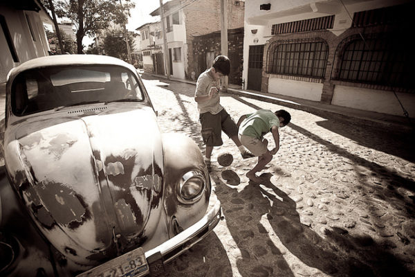 Kids playing soccer on the streets